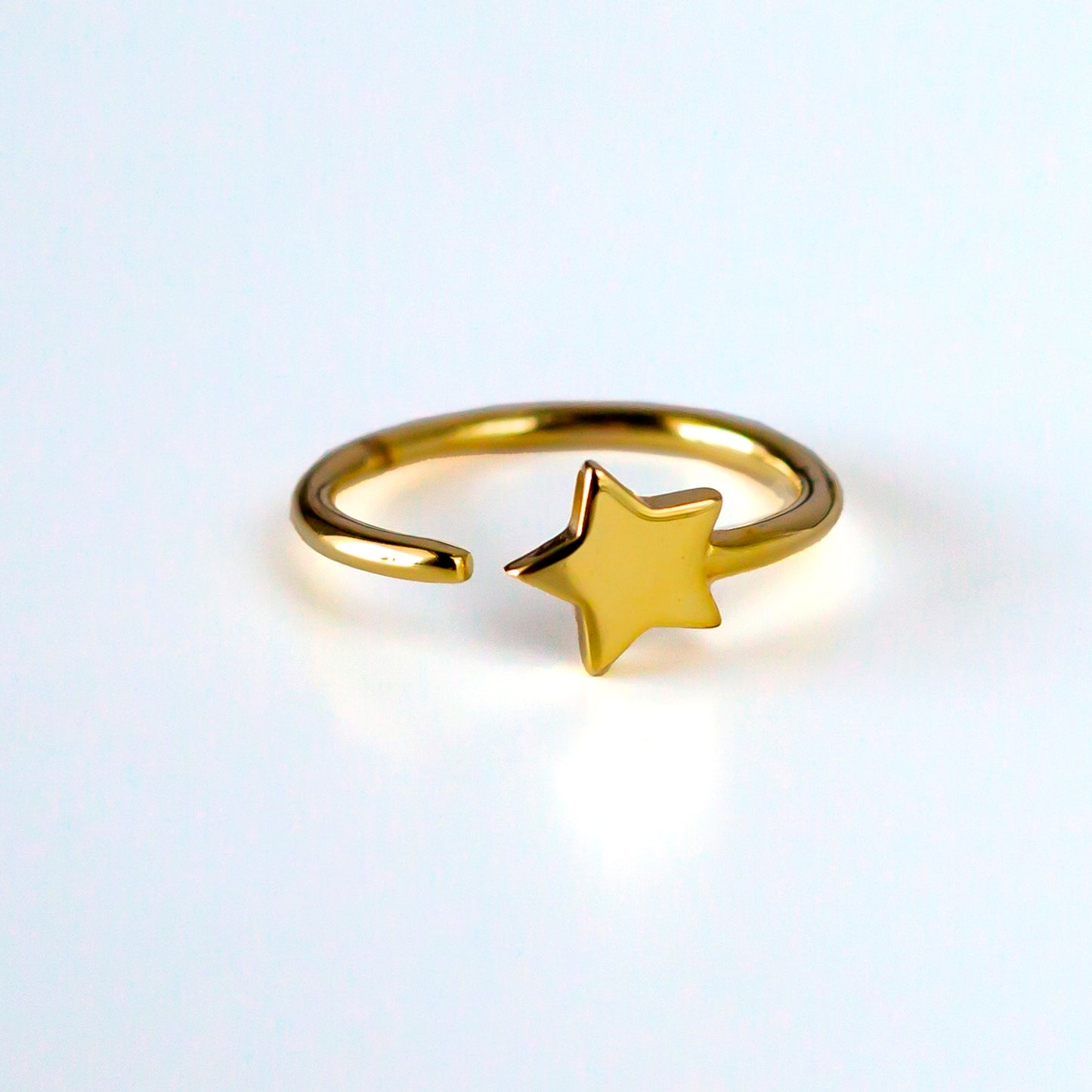 Anillo de plata "Estrella dorada"